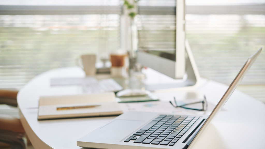 office desk workspace with a laptop opened